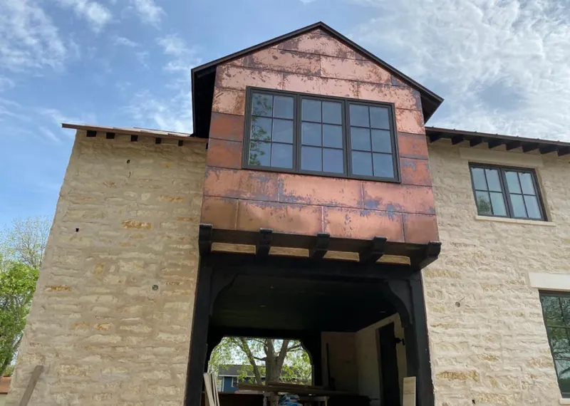 Copper metal panel facade on a stone building for Skylight Installation in El Dorado Hills
